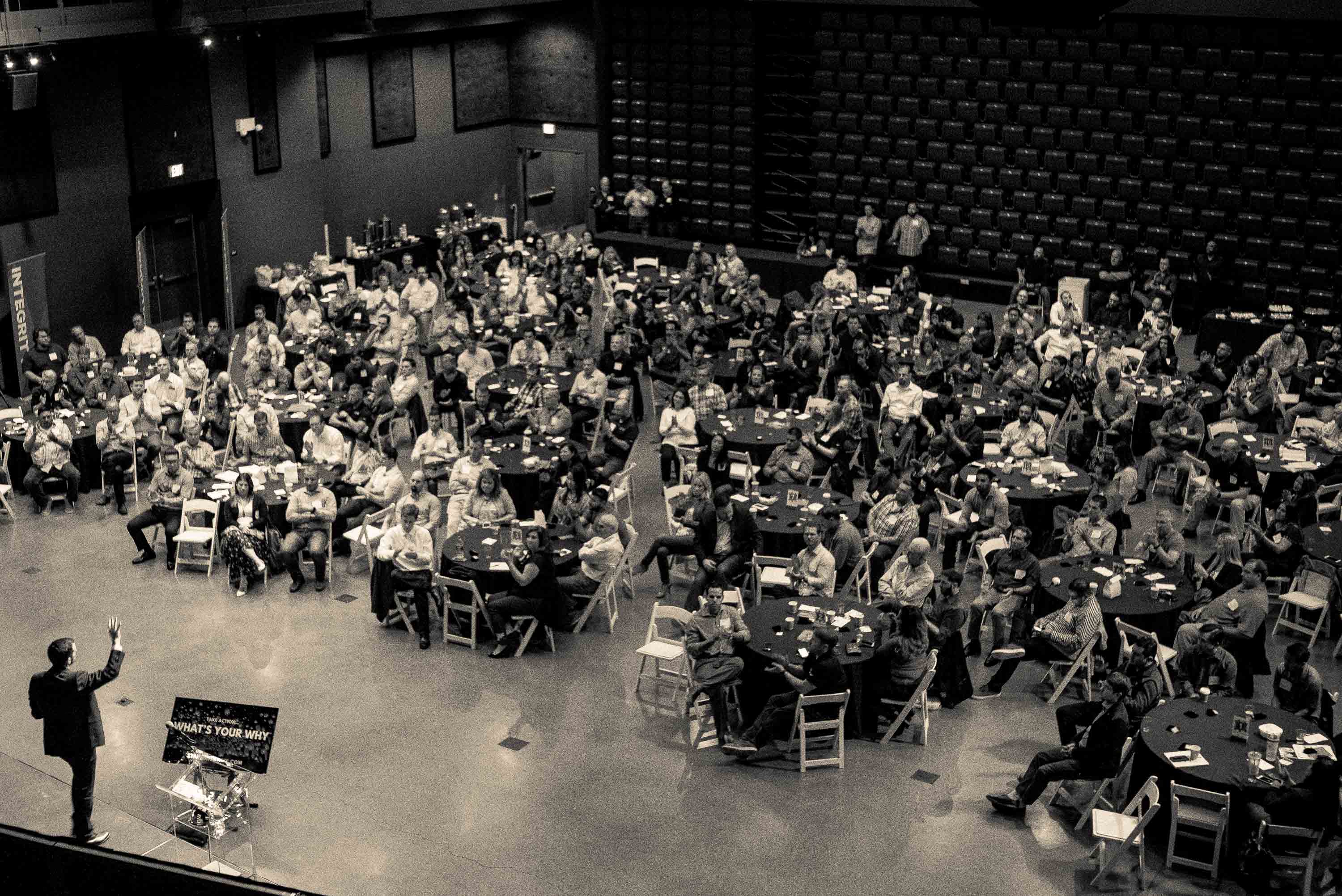 Start With Why instructor commanding the stage